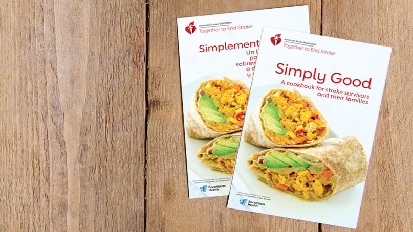 The Simply Good Cookbook and Simplemente Bueno un Libro de Recetas are laying overlapped on wood planks. The Simply Good Cookbook and Simplemente Bueno un Libro de Recetas are laying overlapped on wood planks.
