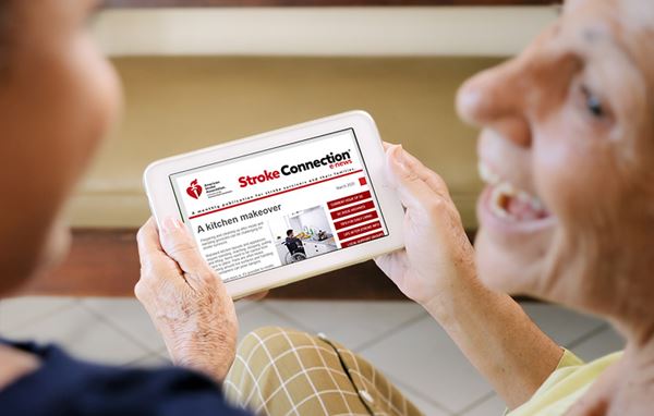 senior woman smiling and reading Stroke Connection on a tablet senior woman smiling and reading Stroke Connection on a tablet